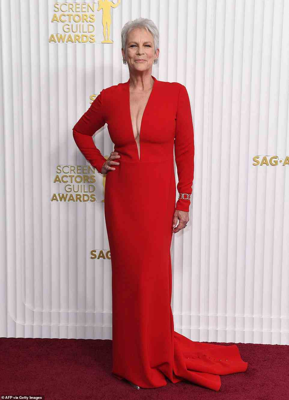Radiant: Jamie Lee Curtis stunned in a plunging red gown as she led the stars at the 29th annual Screen Actors Guild Awards in LA. She is wearing Romona Keveza