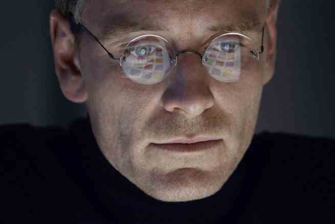 A close-up of Michael Fassbender as Steve Jobs, staring at a screen in the biopic "Steve Jobs"