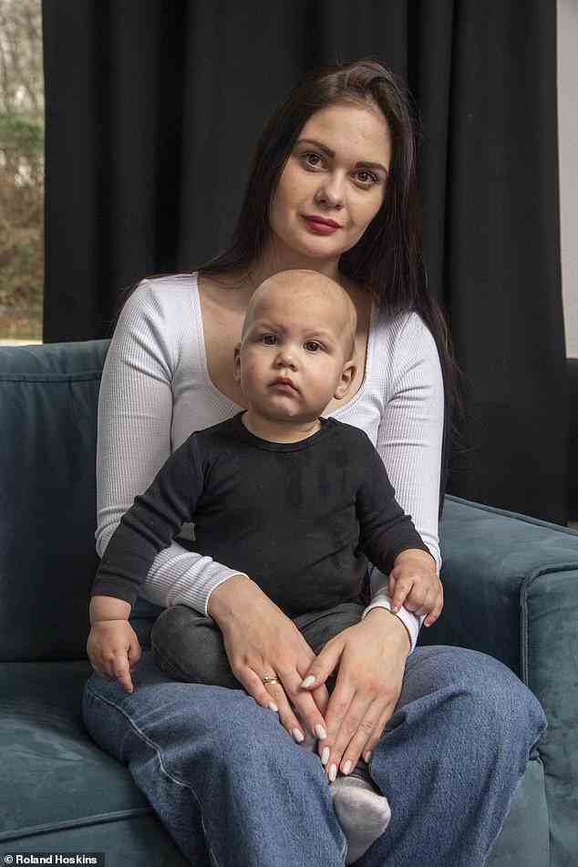 'I was told the baby could not survive. I was giving birth under fire, with my hands over my ears because it was so loud,' says Anastasia Piddubna. The 26-year-old is pictured with her son, Damir, now 11 months old