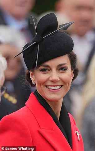 The royal mother-of-three donned an eye-catching scarlet coat for the occasion, sweeping her hair into an up-do and donning a smart black fascinator