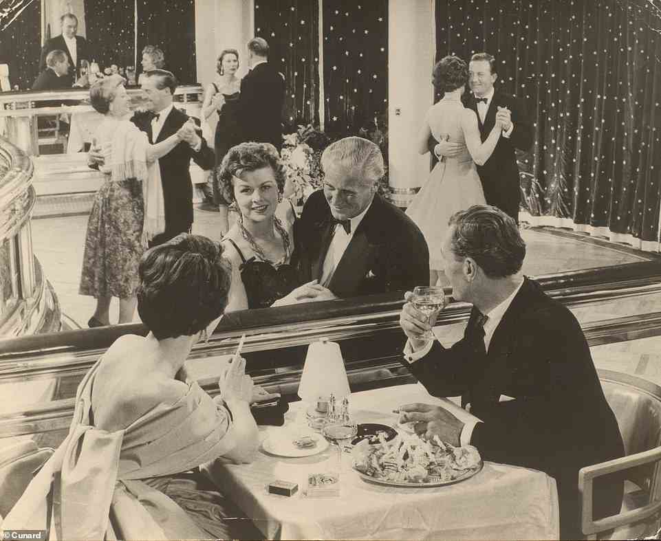 Couples dancing and dining in the Verandah Grill on board Cunard's Queen Mary in the 1950s