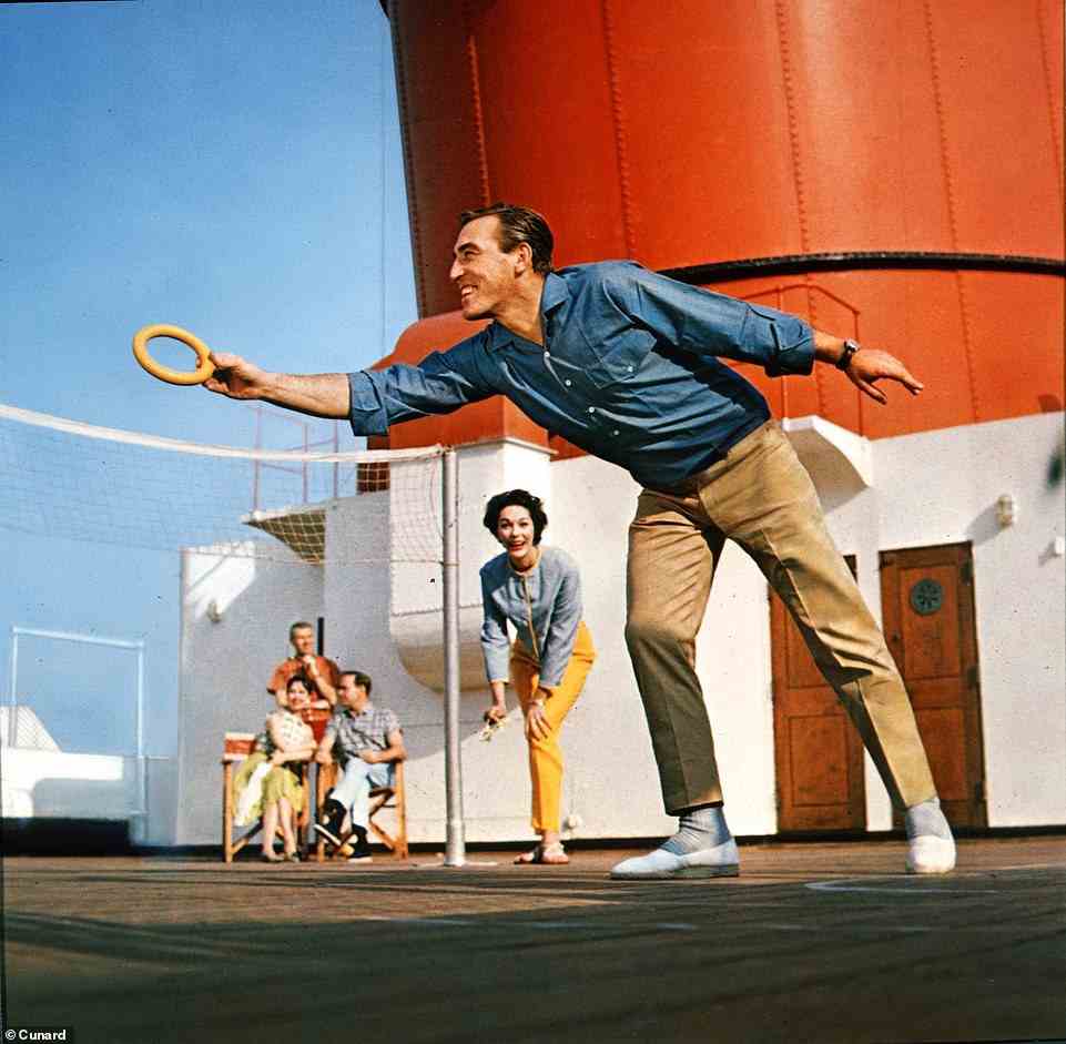 A Cunard passenger catches a hoop during a deck game in this undated shot, with the ship's funnel pictured in the background