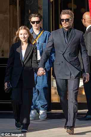 Smart: Suits appeared to be the name of the game for the famous clan, as both David and daughter Harper stepped out looking smart