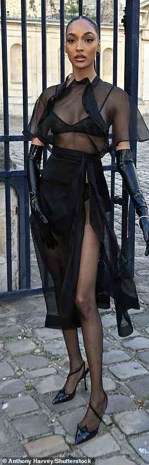 Dare to bare: Jourdan Dunn was showing some skin in a sheer black ensemble