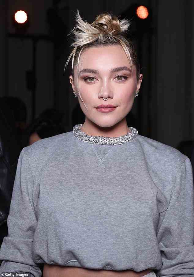 Details: She added a touch of glamour to the otherwise casual grey jumper with a sparkly choker necklace