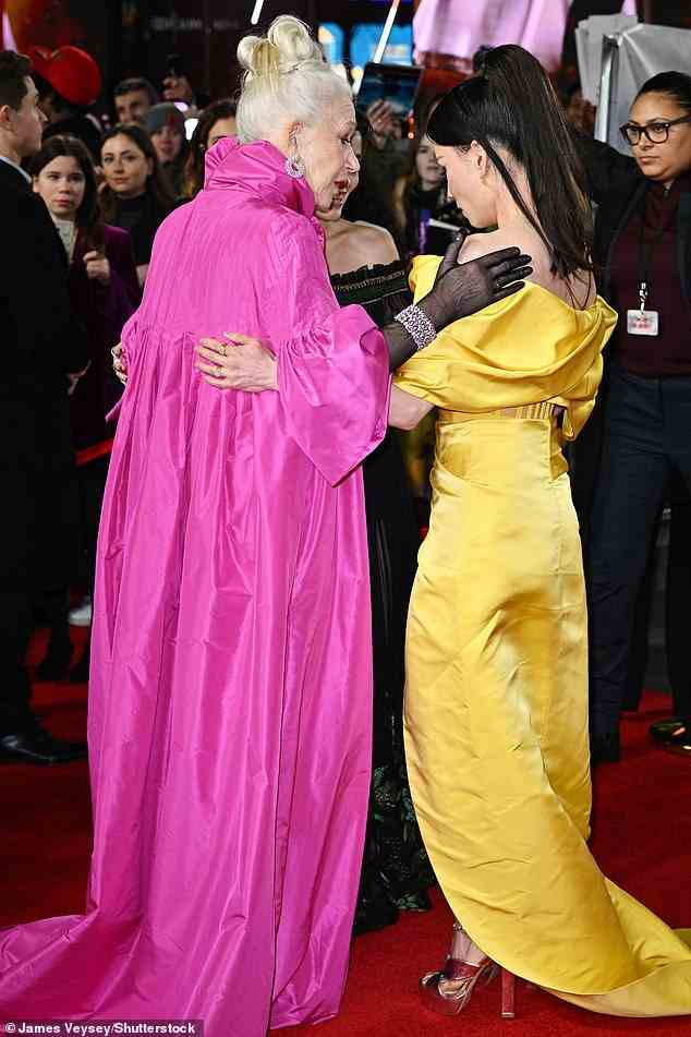 Friends in high places: Dame Helen placed her hand on Lucy's shoulder as the pair chatted on the red carpet