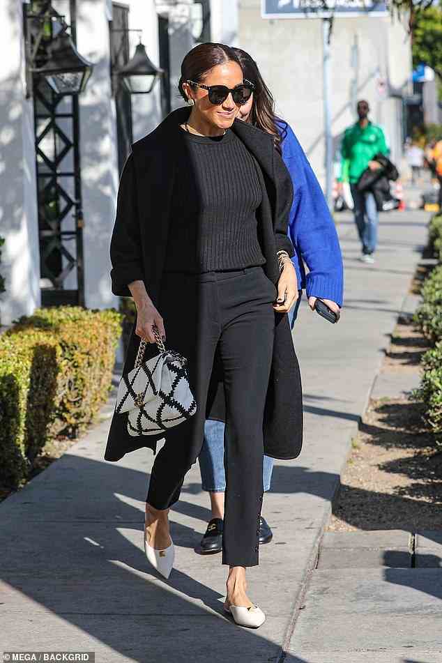 Meghan outside the restaurant in West Hollywood on International Women's Day yesterday