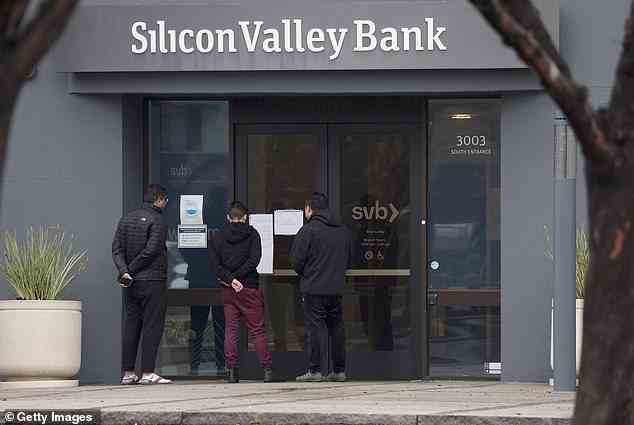 Employees read a notice outside of the shuttered Silicon Valley Bank (SVB) headquarters. Silicon Valley Bank was shut down on Friday morning in the biggest bank failure since 2008