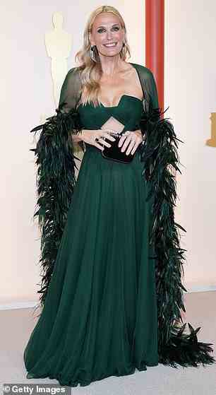 Model Molly Sims, 49, paired her green gown with a tacky feather boa