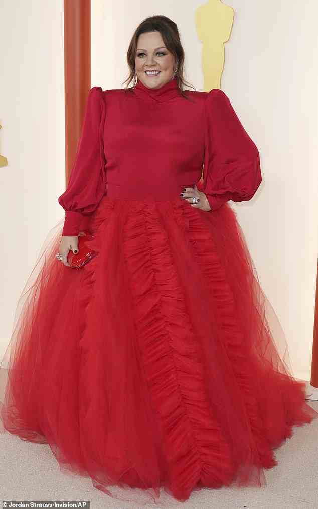 Bridesmaids actress Melissa McCarthy, 52, wore a fluffy red gown with dramatic sleeves