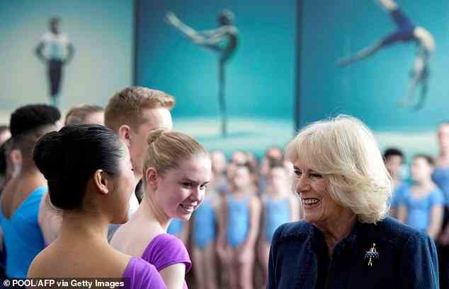 Camilla smiled as she spoke with students during her visit to Elmhurst Ballet School, which was initially set to take place last month