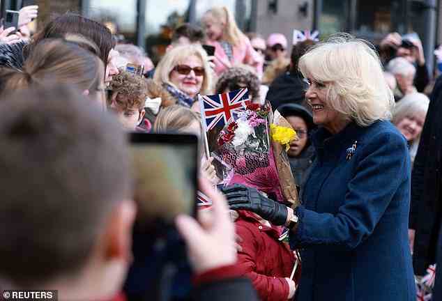 Camilla smiled as excited children formed crowds to greet the Queen Consort on her visit to the library