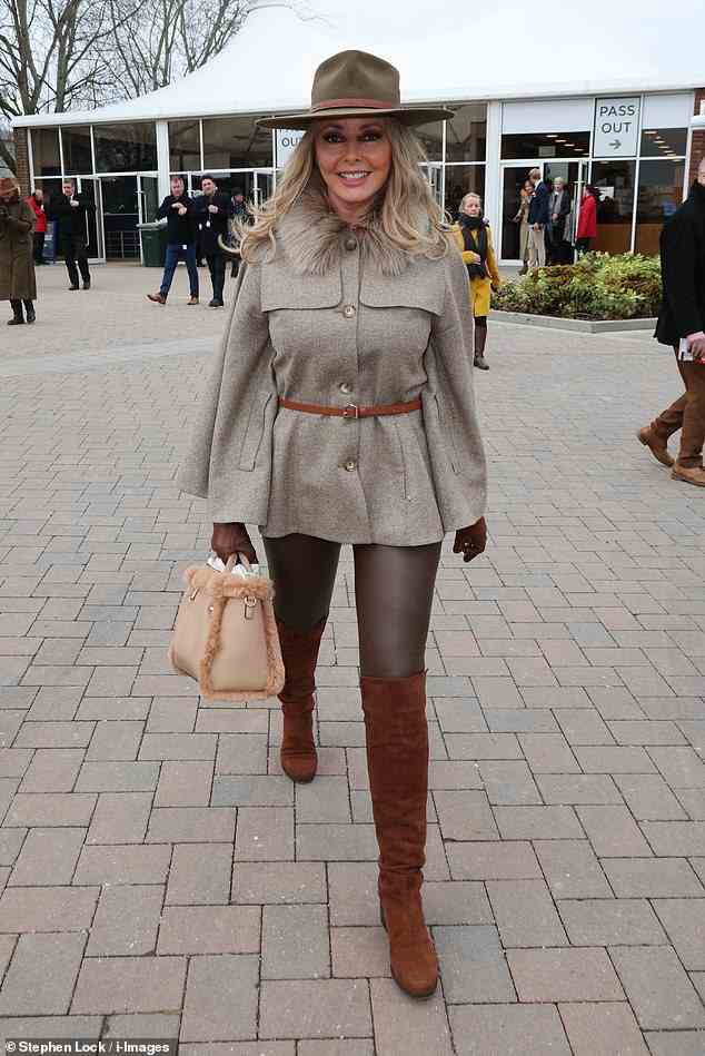 Carol Voderman, 62, completed her outfit with a fur-trimmed beige handbag for today's event in Cheltenham