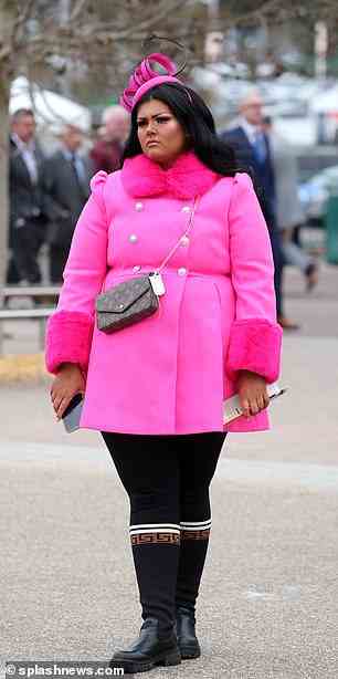 This Cheltenham guest stunned in a bright pink coat with faux fur trim and leggings