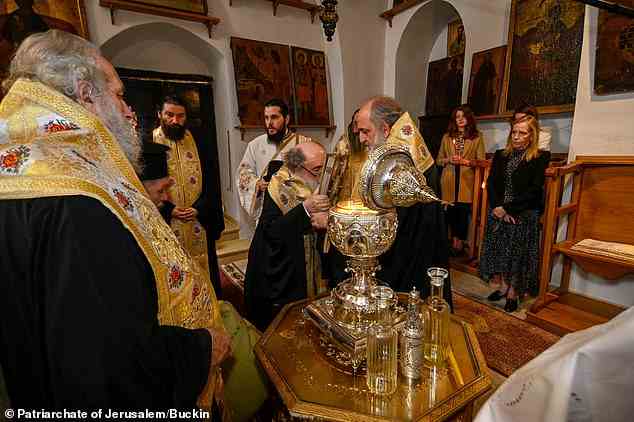 Pictured: Oils from the Mount of Olives being mixed with essential oils and blessed in Jerusalem on March 3 to become Chrism Oil, which will be used in the Coronation