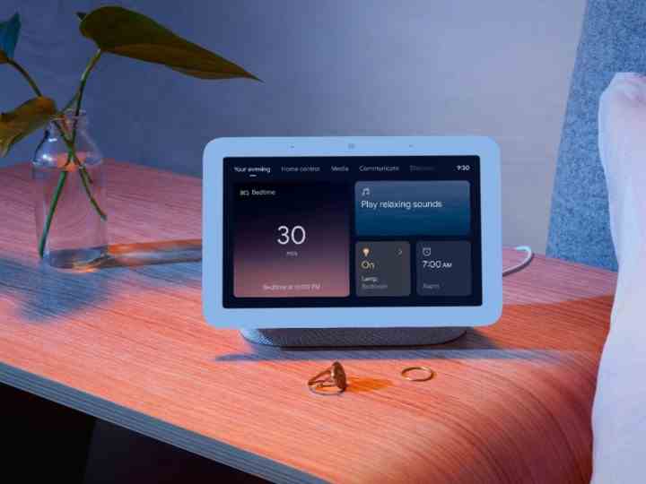 The Google Nest Hub Smart Display on a nightstand.