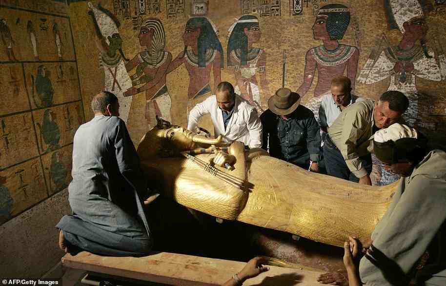 Egypt's antiquities chief Zahi Hawass (3rd L) supervises the removal of the lid of the sarcophagus of King Tutankhamun in his underground tomb in the famed Valley of the Kings in  2007.
