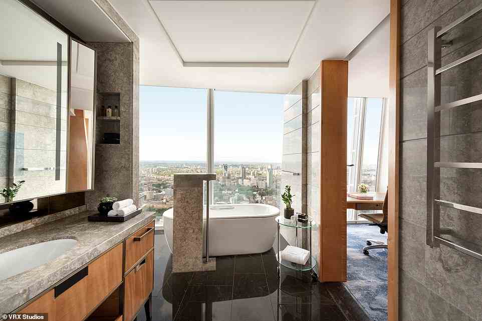 The high life: Ted's Deluxe City View King Room (room type pictured above) on the 43rd floor featured a standalone tub next to floor-to-ceiling windows