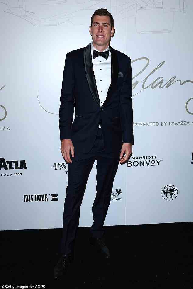 AFL player Mason Cox looked classically handsome in a tuxedo on the red carpet