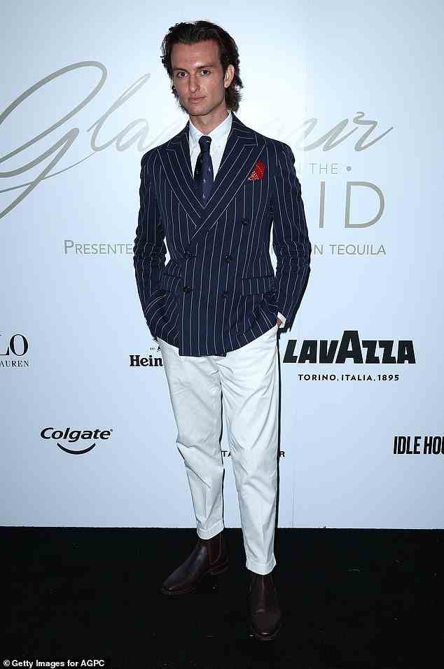 Meanwhile Cameron Robbie, the younger brother of A-lister Margot, showed off his sleek style in a nautical inspired suit with white slacks and a navy stiped blazer