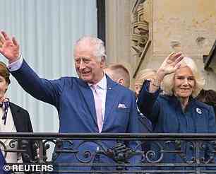 King and Queen Consort wave to adoring crowds