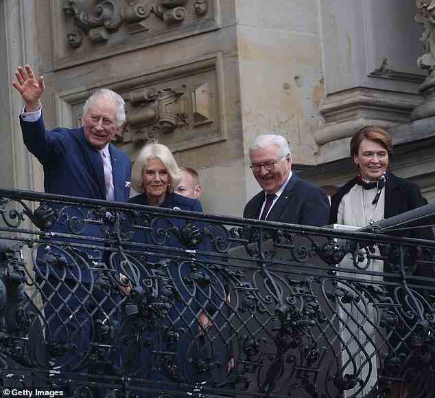 King Charles III, Camilla, Queen Consort, German President Frank-Walter Steinmeier and First Lady Elke Buedenbender wave to the public from the balcony