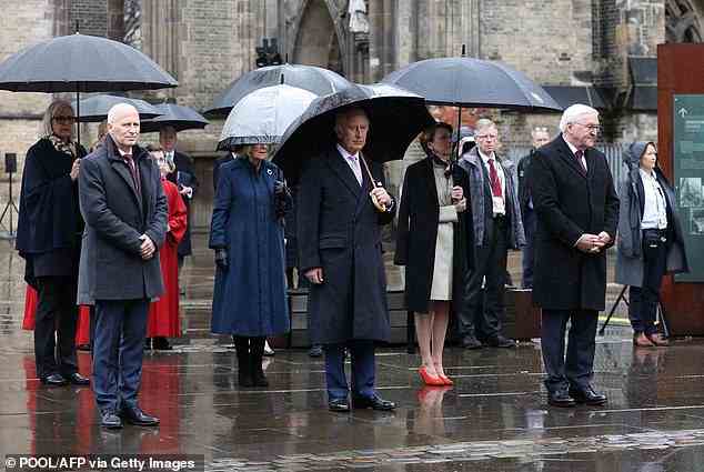 The King looked solemn in silence as he attended the church and wreaths were laid, while the Queen Consort stood behind him