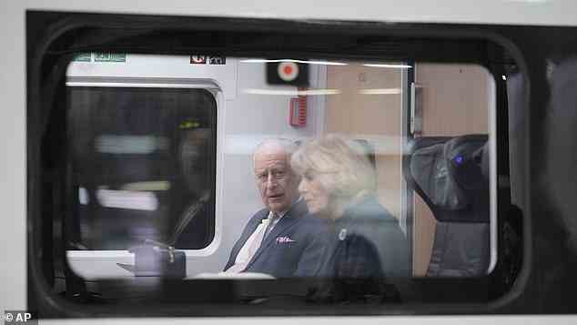 Their Majesties looked comfortable as they sat on the train which was ready to depart Berlin on the way to Hamburg
