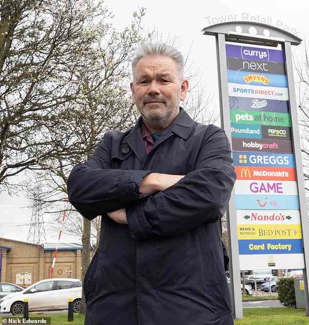 'I want to bring down the system': Lawrence Carnie, 58, was slapped with a £100 ticket for a a '22-hour' stay at the Tower Retail Park car park in Dartford, Kent in June last year - but he claims the alleged overnight stay which was actually two half-hour stays on consecutive days. Pictured: Mr Carnie at the Tower Retail Park car park