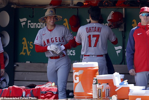 The Angels' Logan O'Hoppe is congratulated by Shohei Ohtani after hitting a home run