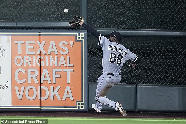 Chicago White Sox center fielder Luis Robert Jr. makes a running catch on a fly ball