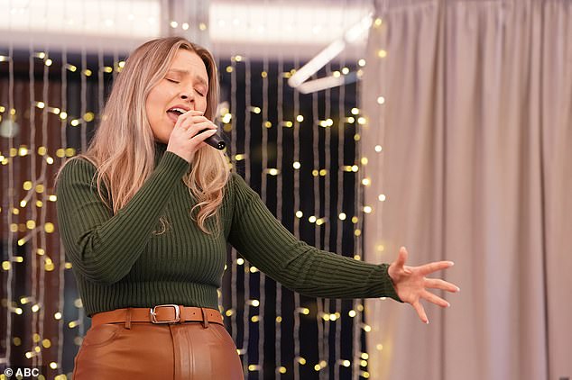 Impressed: The 21-year-old radio host from Armorel, Arkansas sung a soulful version of Zach Bryan's Something in the Orange for her performance, which impressed the judges