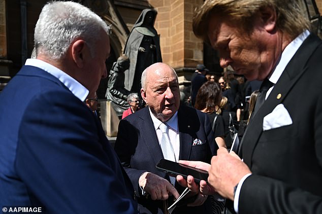 Alan Jones (centre) was among the mourners at Brian Walsh's funeral on Monday, along with former News Corp CEO John Hartigan (left) and entertainment reporter Richard Wilkins (right)