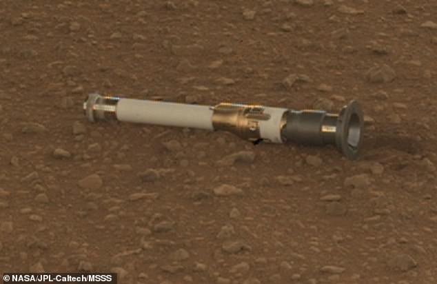 The rover took duplicates of 10 of the 19 samples it has picked up so far, which it has dropped at a special location at the base of the delta. Pictured: One of the duplicate samples left at the 'Three Forks' location