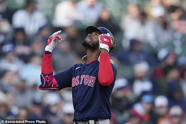Boston Red Sox's Raimel Tapia looks skyward as he approaches home plate after a two-run home run during the ninth inning of a baseball game against the Detroit Tigers, Saturday, April 8, 2023, in Detroit. (AP Photo/Carlos Osorio)