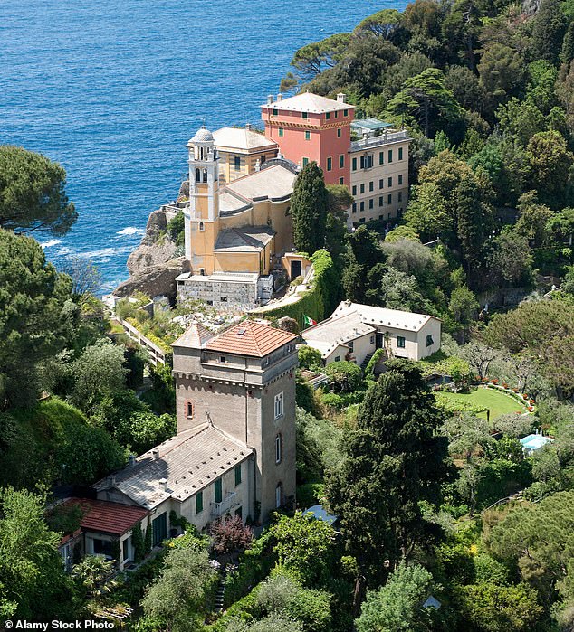Mayor Matteo Viacava insists the ban is not aimed at making the city 'more exclusive' but instead to 'allow everyone to enjoy our beauty' and 'avoid dangerous situations caused by overcrowding'. Pictured: Church of San Giorgio in Portofino, Italy