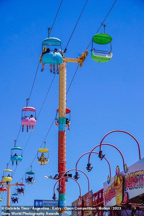 This vibrant picture by photographer Gabriela Timo shows an amusement park in Santa Cruz, California, in the summertime. It was entered into the 'Motion' category in the awards' Open Competition