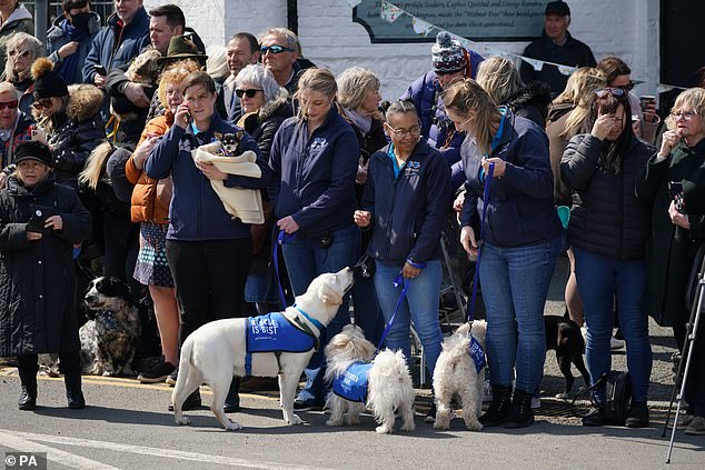 Mourners have arrived from all over the country, many with dogs from Battersea