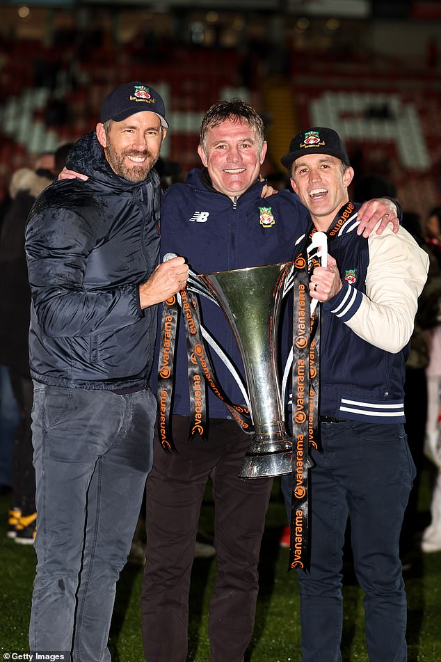 Huge occasion: Ryan Reynolds and Rob McElhenney pose for a picture with manager of Wrexham FC Phil Parkinson with the Vanarama League Trophy