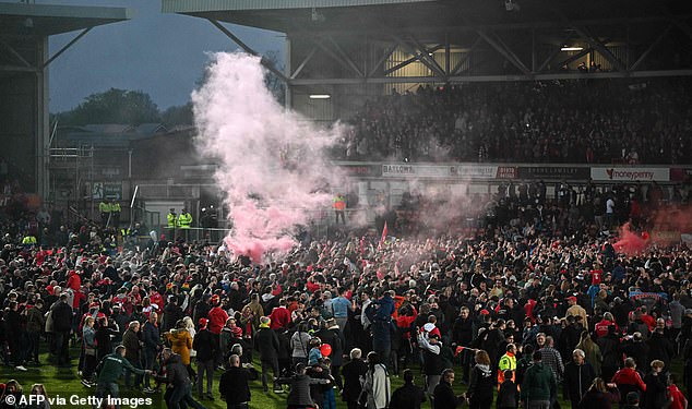 Electric: The atmosphere in the Racecourse Ground Stadium really lifted off when fans stormed the pitch