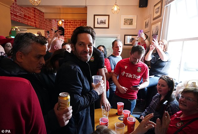 Crowds: The Turf Pub in Wrexham was rammed full of fans and Rudd's appearance made the atmosphere even more rowdy