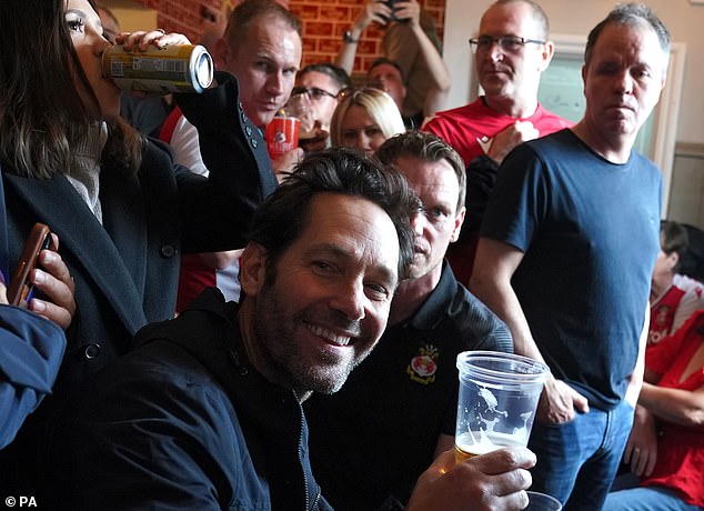 Happy days: Paul was soaking up the atmosphere before heading into the Wrexham grounds