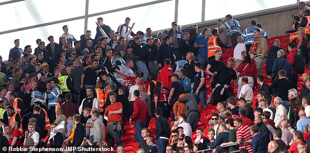 Modern day clash: Crowd trouble erupts at a clash between Millwall and Barnsley in May 2016