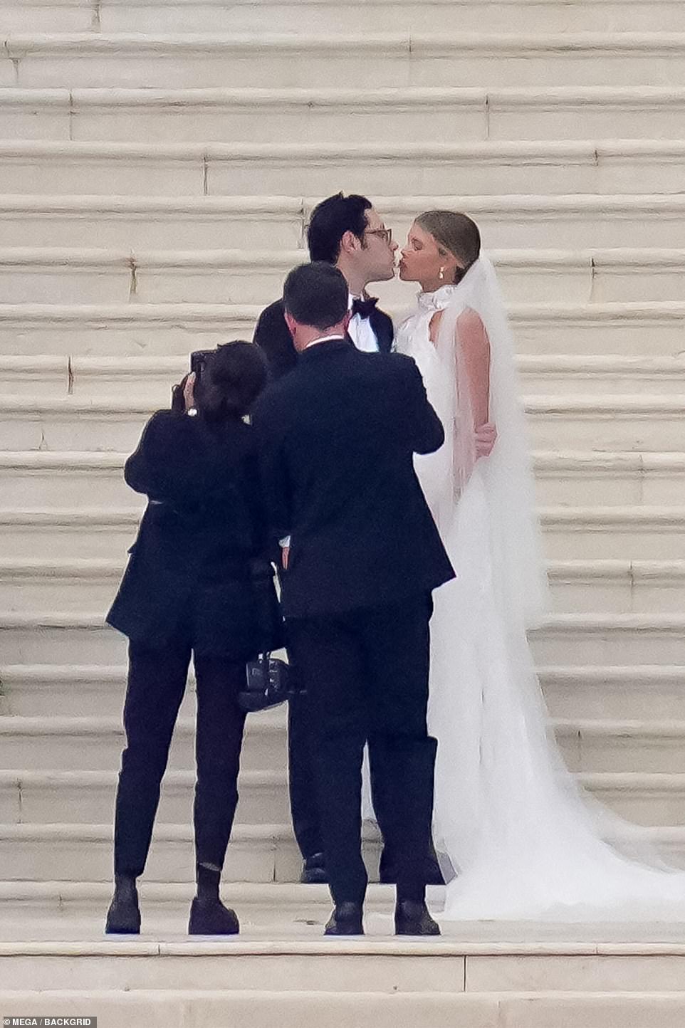 Pucker up! Sofia and new husband Elliot couldn't keep their hands - or lips - off each other shortly after the ceremony