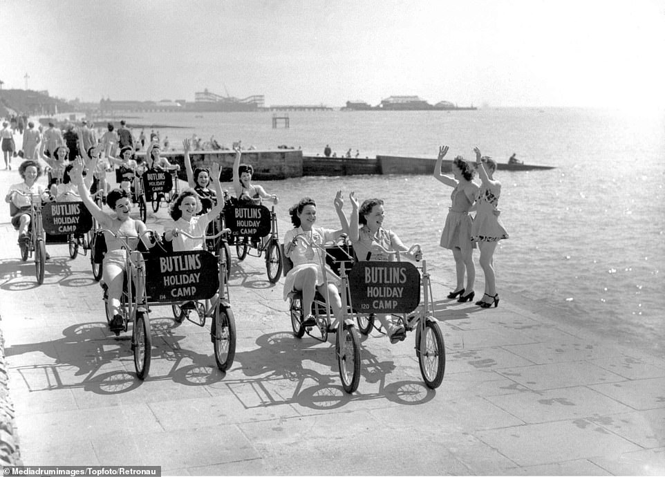 Yesteryear: A fleet of women cycling down Clacton-on-Sea's promenade in novelty bikes in a picture dated to the 50s or 60s