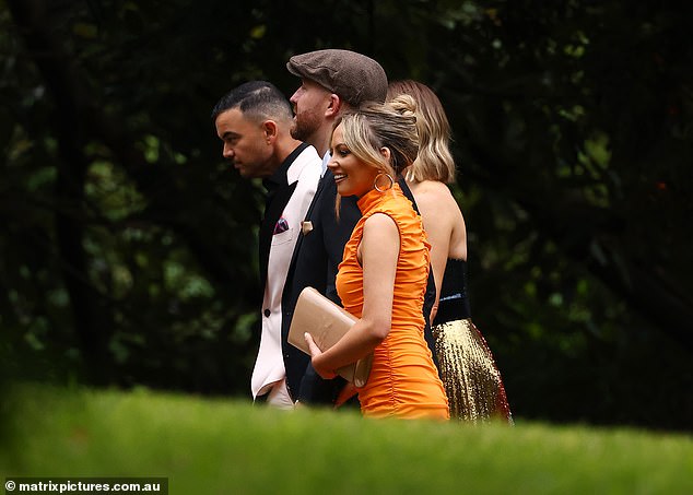 Guests also included Samantha Jade, in the orange dress, and her husband Pat Handlin, in the flat cap, pictured walking alongside Guy and Jules Sebastian