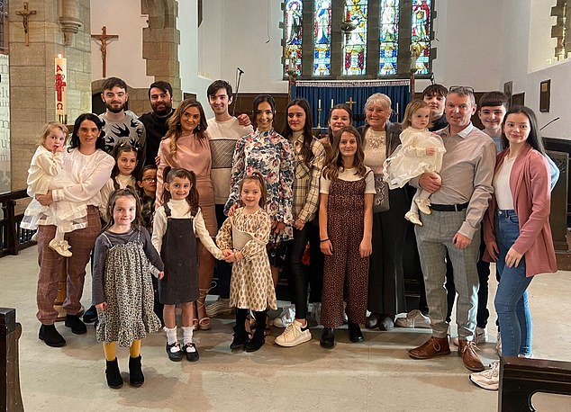 The Radfords meteoric rise to fame is no doubt owed to proud parents Sue, 48, and Noel, 52, who have amassed an astonishing 22 children and 13 grandchildren in just three decades (pictured with 18 of their children at Heidie's christening)