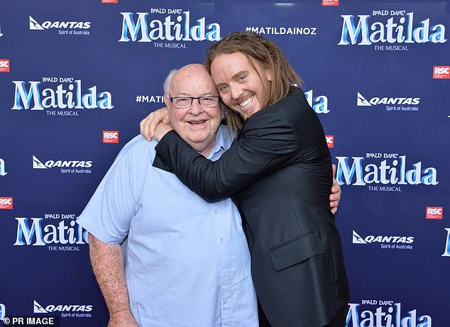 Father Bob (left), pictured with singer Tim Minchin (right) died on Wednesday aged 88