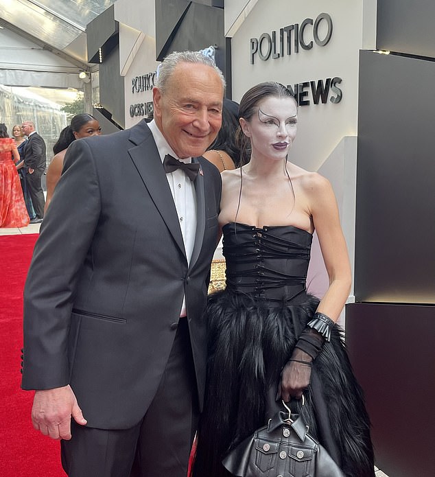 Clad in a tuxedo for the black-tie event, the 72-year-old Senate leader posed for multiple photos with the Uncut Gems actress, who donned dramatic face makeup and a black, leather ensemble for the black tie gathering at the Washington Hilton Saturday evening