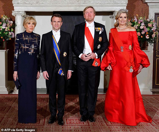 Queen Máxima of the Netherlands made a bold fashion statement with a gorgeous scarlet gown as she and her husband welcomed President Emmanuel Macron and his wife Brigitte for a state dinner at the Royal Palace in Amsterdam